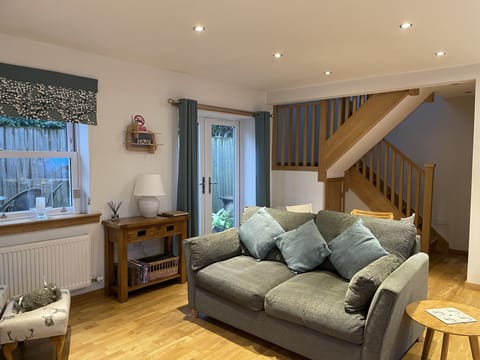 Living /dining /kitchen with French doors to the courtyard garden and hot tub. 