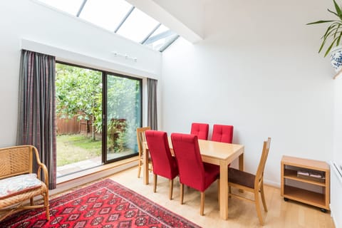 The spacious dining area leads directly into the garden