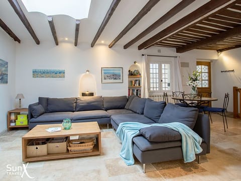 lIving room with dining space in the background