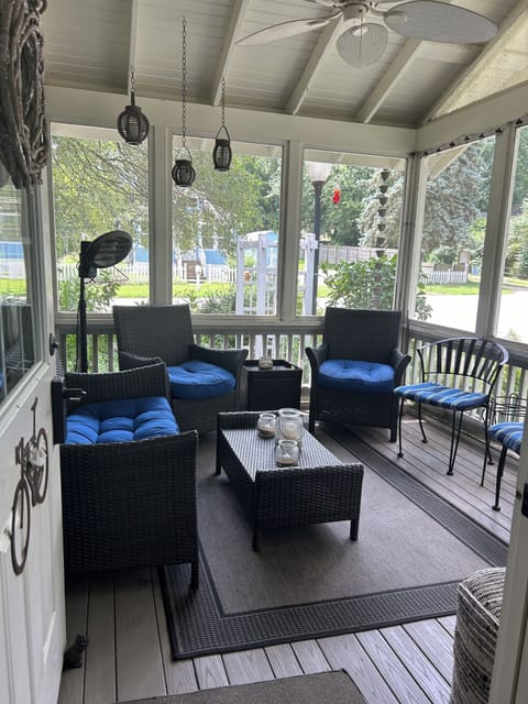 Screened-in front porch is the perfect place for enjoying your morning coffee.