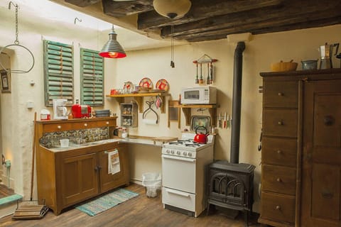 Repurposed Dry Sink With Tile Counter Top.  Gas Log Stove For Heat
