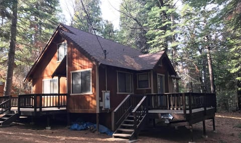 View from just off the road.  Pines make deck  great for relaxing or socializing