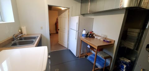Laundry room with full size fridge/freezer