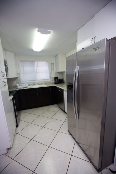 Full refrigerator & freezer. Dishes & utensils. 
Should we eat outside instead?