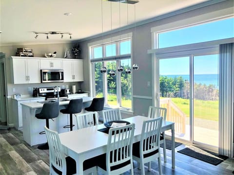 Open-concept  kitchen with ocean views and a sundeck at your footsteps