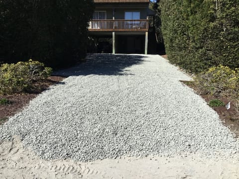 New gravel parking area.  Room for 8 cars under house and driveway.