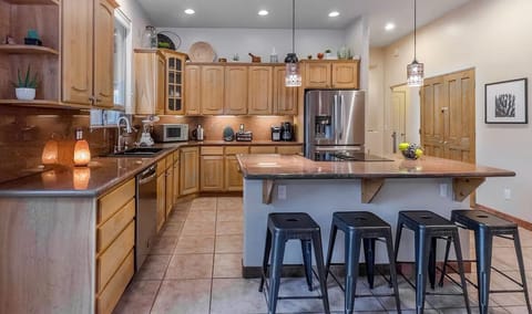 Spacious kitchen with granite countertops.