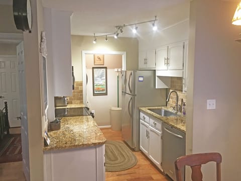 Galley Kitchen with Stantless Steel Appliances, Farmhouse Sink & Granite Counter