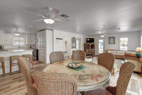 1st Floor - Spacious and vibrant with beachy vibes throughout this open kitchen–living–dining space.