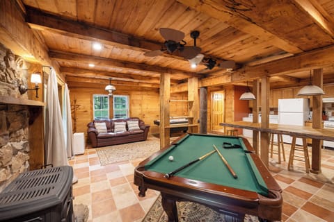 Lower level game room with pool table, foosball, washer & dryer