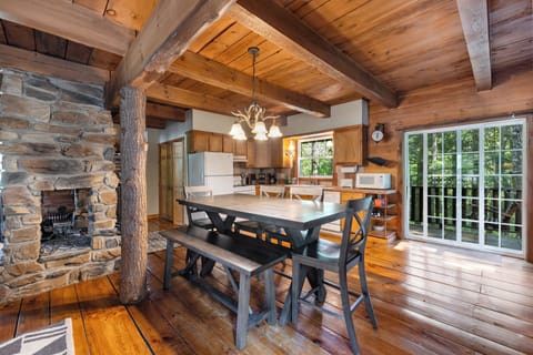 Dining area and well stocked kitchen with all your cooking needs 