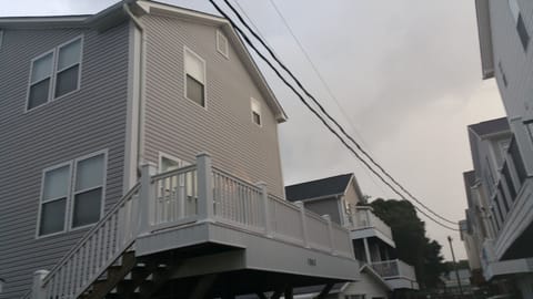 Photo showing  upgraded deck railings, same deck on backside of house as well.