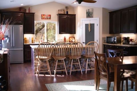 Large granite island provides seating for up to 8 people.