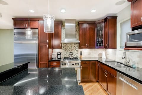 Chef kitchen with Sub-Zero refrigerator, Wolf stove, Bosch dishwasher.