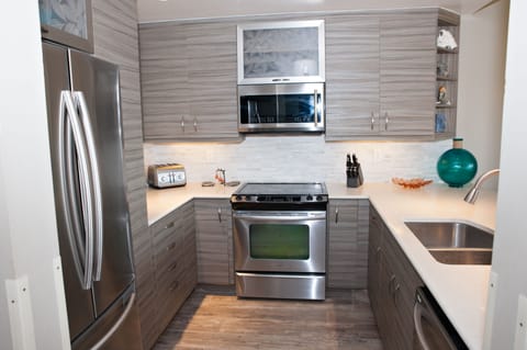 Bright, open gourmet kitchen with stainless steel appliances