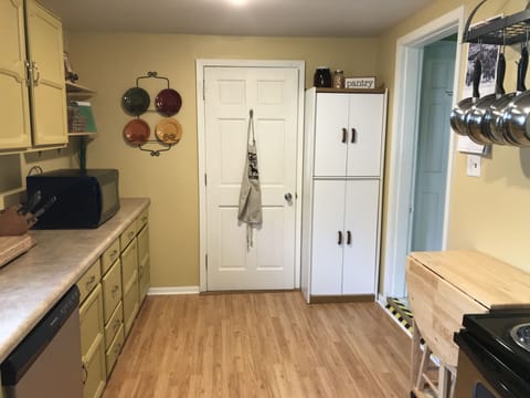 Microwave, dishwasher, extra pots and pans, pantry