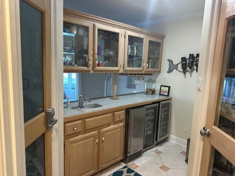 Wet bar w/ice machine and 2 beverage coolers.