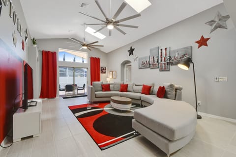 Large living room with 65 inch flat screen tv