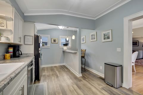 view from side entrance into kitchen
note eat in area 