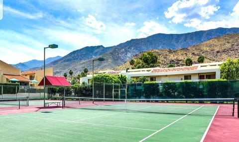Lighted tennis court. We have tennis and golf equipment provided at our condo!
