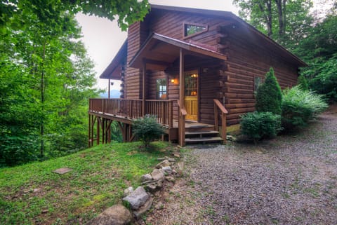 Cozy log cabin nestled in the mountains.