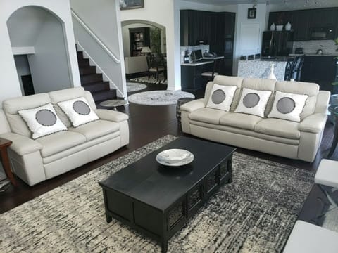 A living room with cable and fireplace to sit back and relax.