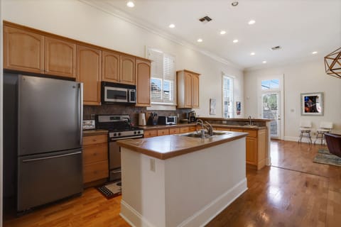 Chef's kitchen opens to spacious den.