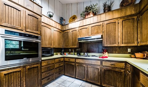 The kitchen features a wall oven