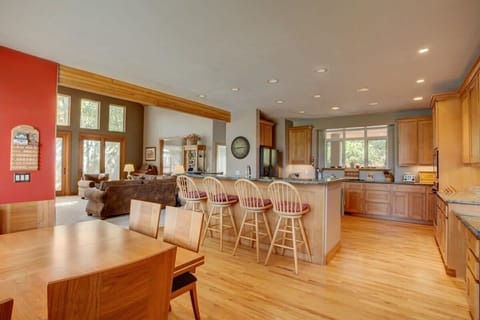 Open kitchen (fully-equipped) with breakfast bar seating and Dinning Room (seats 8) with golf course view