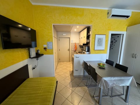 Living room and kitchen in the background
