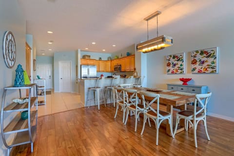 Kitchen Opens into the Dining Area Featuring a Large Table with Seating for 8