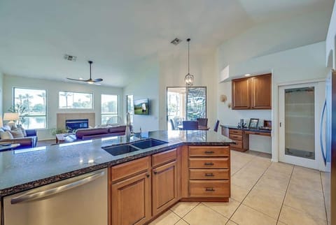 Beautiful lake and pool views from the kitchen and living space.