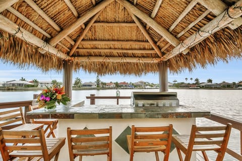 Gorgeous views from the home's Tiki Bar. Grill dinner and sit with the family to enjoy the sunset and watch as the dolphins play in the water.