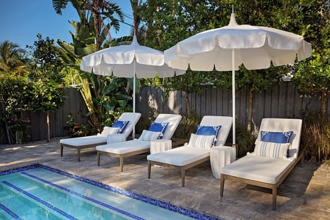 Relax on ultra-comfortable lounge chairs by our lovely, private saltwater pool.