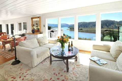The living room has two deep really comfortable deep seated sofas to enjoy the views from morning to sunset!