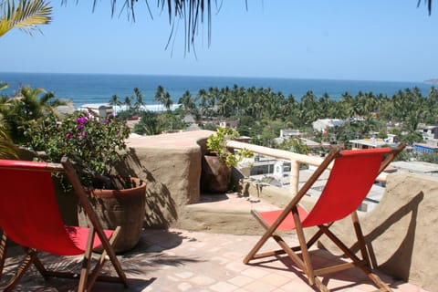 Lounge and dream on rooftop terrace with 360 view, chaise lounges, outdoor couch