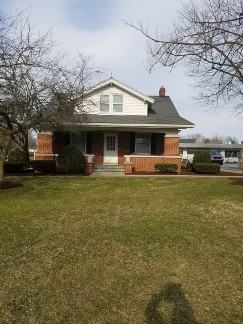 Front of home with large porch and key pad for easy entry