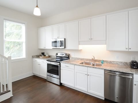 Pink House - The kitchen. Space includes a dining table and is attached to the living space making for a very comfortable open floor plan. 