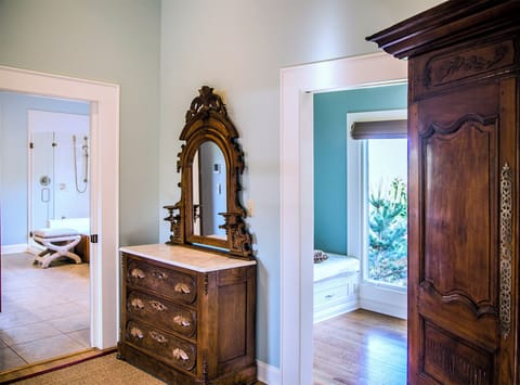 The Luxury Suite's antiques counterpoint modern personal amenities.