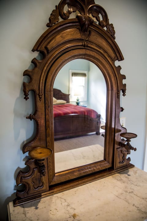 19th Century hand carved dresser with marble top and adjustable mirror. 