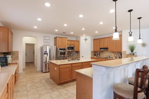 Kitchen with desk and island. 