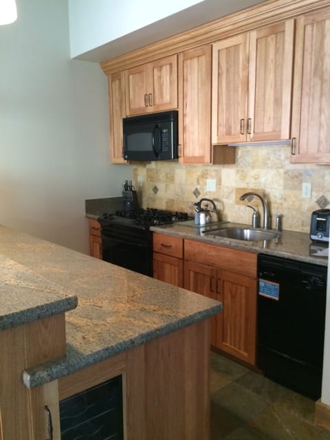 Wine cabinet at end of counter