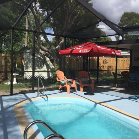 Private back yard with inground splash pool. 