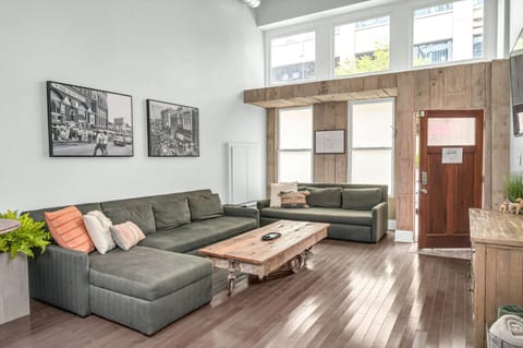 Spacious living room with two luxury queen sleeper sofas to sleep 4 guests