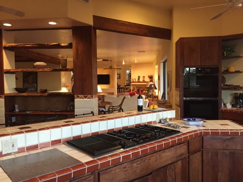 Six burner gas stove/grill, two ovens, sub zero style refrigerator, wine fridge