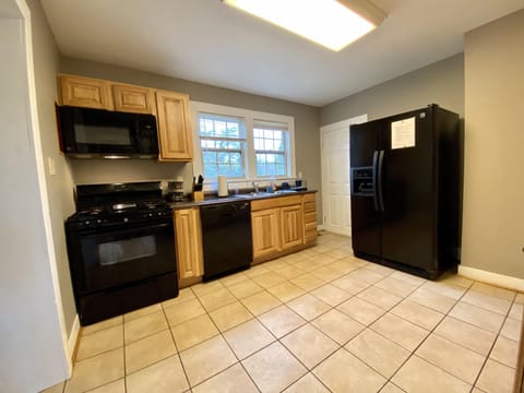 Kitchen with Gas Stove, Microwave, Dishwasher and Side by Side Refrigerator