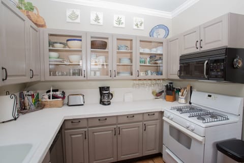 The kitchen is well stocked for cooking.