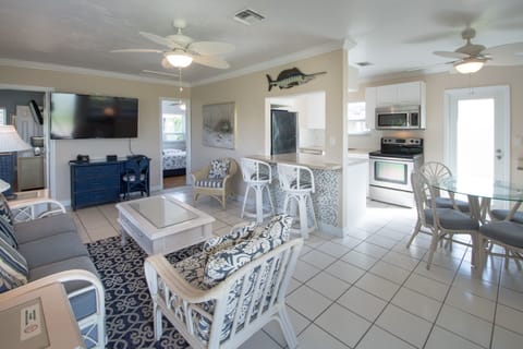 View from front door into villa | Open-kitchen engages a happy chef