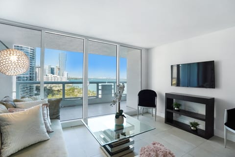 Living room, Roku tv, balcony access, water and park views
