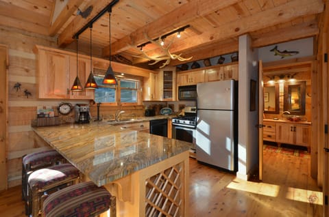 Bar granite top with three hand-crafted stools and wine rack